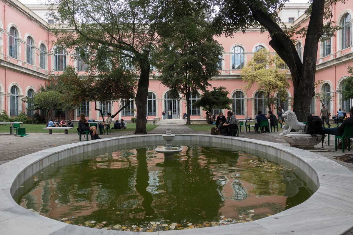 Students sitting in school yard