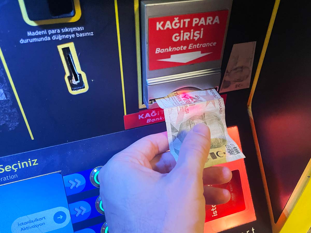 Putting money into the machine