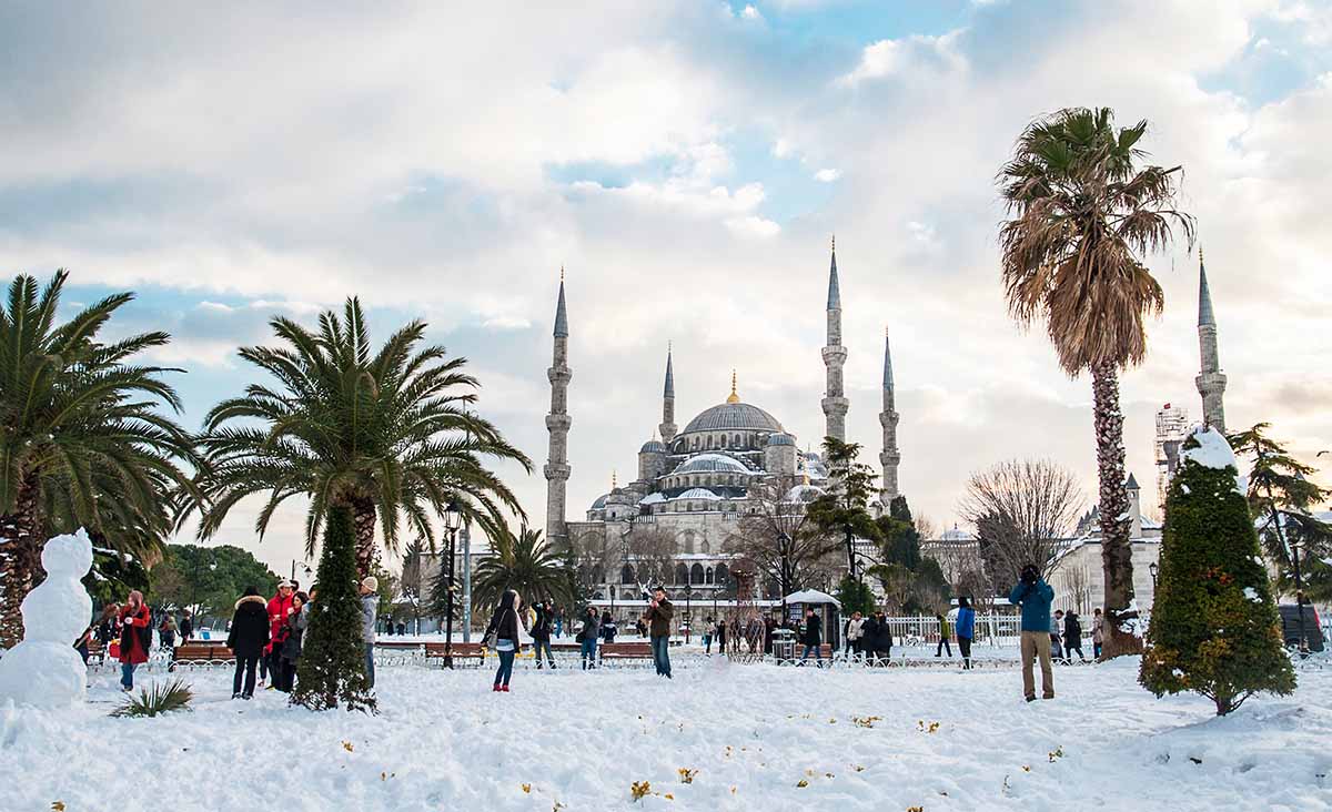 Snowing at a mosque in Istanbul during winter